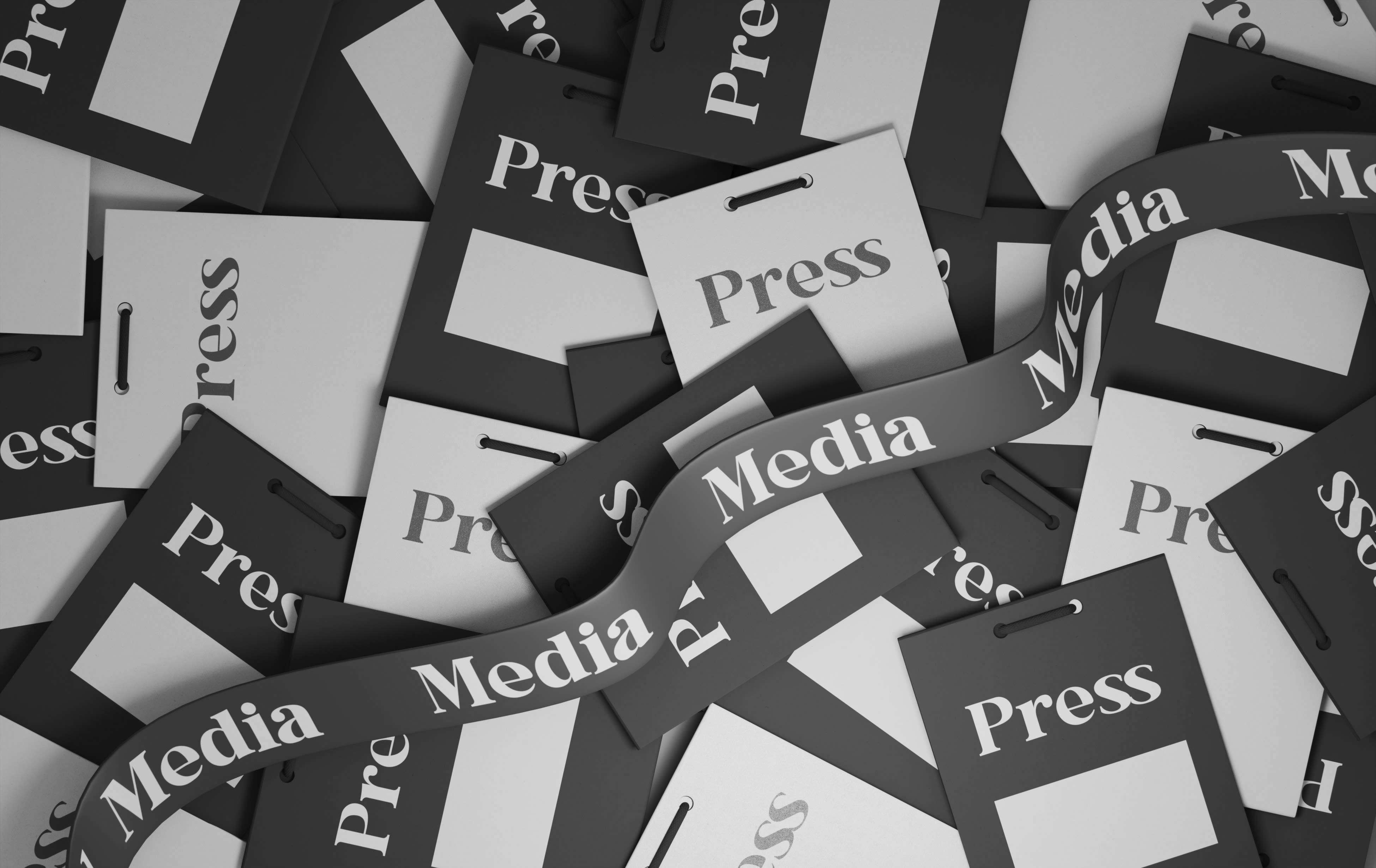 Press and media passes in a pile